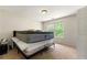 Bedroom featuring a bright window, neutral walls, and carpeted floors at 930 Palmer Rd, Lithonia, GA 30058