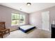 Bedroom featuring a bright window, neutral walls, and carpeted floors at 930 Palmer Rd, Lithonia, GA 30058