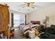 Sunny bedroom with a ceiling fan, and lots of natural light; ready for personal touches at 930 Palmer Rd, Lithonia, GA 30058