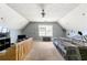Attic bedroom featuring a window, textured walls, and low ceilings at 930 Palmer Rd, Lithonia, GA 30058