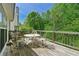 Wooden deck with outdoor seating and a view of the surrounding trees at 930 Palmer Rd, Lithonia, GA 30058