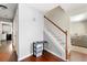 Welcoming foyer with hardwood floors and staircase leads to the upper level of the home at 930 Palmer Rd, Lithonia, GA 30058