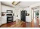 Well-equipped kitchen with matching appliances, ample cabinet space, and hardwood flooring at 930 Palmer Rd, Lithonia, GA 30058
