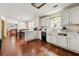 Functional kitchen with ample counter space, white cabinets, and hardwood flooring, perfect for meal prep at 930 Palmer Rd, Lithonia, GA 30058