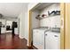 Convenient laundry area with washer and dryer, providing ease and efficiency at 930 Palmer Rd, Lithonia, GA 30058
