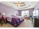 Large main bedroom with trey ceiling, ceiling fan, and plenty of natural light at 930 Palmer Rd, Lithonia, GA 30058