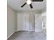 Bedroom with carpet, ceiling fan, and double door closet at 1660 Mallard Cir, Conley, GA 30288