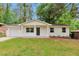 Charming one-story home with a well-maintained front yard and painted white brick at 1660 Mallard Cir, Conley, GA 30288