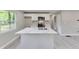 Modern kitchen with white cabinets, stainless steel appliances, and marble countertops at 1660 Mallard Cir, Conley, GA 30288