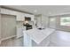 Modern kitchen with white cabinets, stainless steel appliances, and marble countertops at 1660 Mallard Cir, Conley, GA 30288