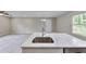 Modern kitchen features a stainless steel sink and faucet, with elegant marble countertops at 1660 Mallard Cir, Conley, GA 30288