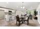 Open living space with a modern kitchen, dining area, and comfortable seating, perfect for entertaining at 1660 Mallard Cir, Conley, GA 30288