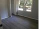 This bedroom has empty closet, a window with lots of natural light, and flooring at 257 E Simon Nw Ter, Atlanta, GA 30318