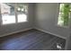This empty bedroom features natural light from two windows, with simple flooring and neutral walls at 257 E Simon Nw Ter, Atlanta, GA 30318