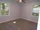 This bedroom features natural light from two windows, with simple flooring and neutral walls at 257 E Simon Nw Ter, Atlanta, GA 30318