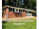 Charming brick home with a freshly landscaped yard and inviting front porch at 257 E Simon Nw Ter, Atlanta, GA 30318