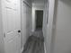The long hallway features multiple doors and a hard surface flooring at 257 E Simon Nw Ter, Atlanta, GA 30318