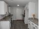 Well-lit kitchen featuring granite countertops, white cabinets, and stainless steel appliances at 257 E Simon Nw Ter, Atlanta, GA 30318