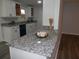 Modern kitchen with granite countertops, white cabinetry, and stainless steel appliances at 257 E Simon Nw Ter, Atlanta, GA 30318