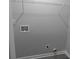A utility area with a gray interior, equipped with shelving and washer-dryer hookups for convenient laundry at 257 E Simon Nw Ter, Atlanta, GA 30318