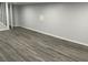 Open-concept living room with gray flooring and ample natural light at 257 E Simon Nw Ter, Atlanta, GA 30318