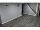 Room featuring stairs and stylish gray wood plank flooring at 257 E Simon Nw Ter, Atlanta, GA 30318