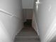 A well lit stairwell leads to the basement at 257 E Simon Nw Ter, Atlanta, GA 30318