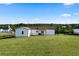 Expansive backyard features a well-maintained lawn and lush green surroundings at 275 Crowe Springs Nw Rd, Cartersville, GA 30121