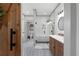 Modern bathroom with tiled floor, white tile shower, and a view of a second bathroom at 275 Crowe Springs Nw Rd, Cartersville, GA 30121