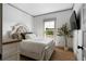 Charming bedroom with a comfortable bed, a large window, and hardwood floors at 275 Crowe Springs Nw Rd, Cartersville, GA 30121
