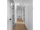 Bright hallway with hardwood flooring, leading to various rooms in the home at 275 Crowe Springs Nw Rd, Cartersville, GA 30121