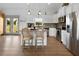 Modern kitchen with stainless appliances, island seating, and open concept living space at 275 Crowe Springs Nw Rd, Cartersville, GA 30121