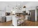 Bright kitchen with an island, stainless appliances, white cabinets, and granite countertops at 275 Crowe Springs Nw Rd, Cartersville, GA 30121