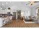 Open living space with hardwood floors, pendant lighting, a comfortable sofa, and stainless appliances at 275 Crowe Springs Nw Rd, Cartersville, GA 30121