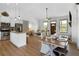 Inviting open-concept living space with island seating and a view to the fireplace and living room at 275 Crowe Springs Nw Rd, Cartersville, GA 30121