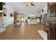Open-concept living space with wood floors, stainless appliances, and dining area with lots of natural light at 275 Crowe Springs Nw Rd, Cartersville, GA 30121