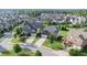 An aerial view showcases a neighborhood with well-maintained lawns and mature trees at 4280 Castlewood Rd, Cumming, GA 30040