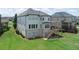 Spacious backyard featuring a deck, patio, and lush green grass perfect for outdoor activities at 4280 Castlewood Rd, Cumming, GA 30040