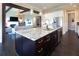 Open concept kitchen with dark island, white countertops, stainless steel appliances, and dark hardwood floors at 4280 Castlewood Rd, Cumming, GA 30040
