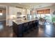 Bright, open kitchen with granite countertops, an island with seating, and eat-in dining space at 4280 Castlewood Rd, Cumming, GA 30040