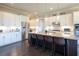 Spacious kitchen with granite countertops, a large island with seating, and stainless steel appliances at 4280 Castlewood Rd, Cumming, GA 30040