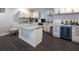 Cozy basement kitchen area with white cabinetry, stone countertops, and a beverage cooler at 4280 Castlewood Rd, Cumming, GA 30040
