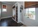 Functional mudroom with built-in storage, a bench, and access to the backyard patio at 4280 Castlewood Rd, Cumming, GA 30040