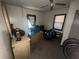 Bedroom with a window, ceiling fan, and various items scattered around at 6475 Church St, Atlanta, GA 30291