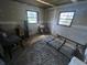 Bedroom with drywall work in progress, features windows and gray rug on the floor at 6475 Church St, Atlanta, GA 30291