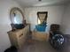 Bedroom features dressers, chair, and car wheels, offering potential for customization at 6475 Church St, Atlanta, GA 30291