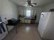 Simple kitchen features white cabinets, stainless steel dishwasher, and tiled floors at 6475 Church St, Atlanta, GA 30291