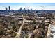 Stunning aerial view of the home nestled among lush trees, with Atlanta's skyline in the background at 1051 Curran Nw St, Atlanta, GA 30318