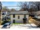 Charming two-story home with a well-manicured lawn and a driveway at 1051 Curran Nw St, Atlanta, GA 30318
