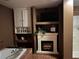 Bathroom with a tub, a fireplace, shelves, and natural lighting at 5925 Tortosa Pl, Atlanta, GA 30349
